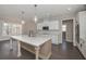 Modern kitchen with island, stainless appliances, and white cabinetry at 4850 Cool Springs Rd, Winston, GA 30187