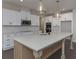 Bright kitchen with island, stainless appliances, and white cabinetry at 4850 Cool Springs Rd, Winston, GA 30187