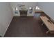 Bright living room features a stone fireplace, dark wood floors, and large windows at 4850 Cool Springs Rd, Winston, GA 30187