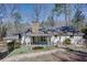 Exterior of home with a covered back porch overlooking the landscaped backyard at 1497 Mason Mill Ne Rd, Atlanta, GA 30329