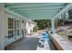 Covered patio with outdoor seating and view of the landscaped backyard at 1497 Mason Mill Ne Rd, Atlanta, GA 30329