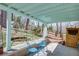 Covered back porch with outdoor seating and view of the backyard and koi pond at 1497 Mason Mill Ne Rd, Atlanta, GA 30329