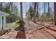 Backyard with a shed surrounded by trees at 1497 Mason Mill Ne Rd, Atlanta, GA 30329