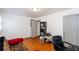 This bedroom features hardwood floors, closet, a futon, and a desk at 1497 Mason Mill Ne Rd, Atlanta, GA 30329