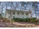 Charming two-story home with a light-colored brick exterior and a row of welcoming columns at 1497 Mason Mill Ne Rd, Atlanta, GA 30329
