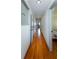Hallway with hardwood floors, doors to other rooms, and overhead lighting at 1497 Mason Mill Ne Rd, Atlanta, GA 30329