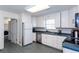 Efficient kitchen featuring plentiful cabinet space, blue countertops, and stainless steel appliances at 1497 Mason Mill Ne Rd, Atlanta, GA 30329