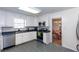 Functional kitchen with ample white cabinetry, blue countertops, and stainless steel appliances at 1497 Mason Mill Ne Rd, Atlanta, GA 30329