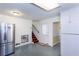 Bright kitchen with white cabinetry, stainless steel refrigerator, and blue tile flooring at 1497 Mason Mill Ne Rd, Atlanta, GA 30329