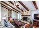 Cozy living room featuring a fireplace, vaulted ceiling, hardwood floors, and natural light at 1497 Mason Mill Ne Rd, Atlanta, GA 30329