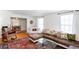 Open-concept living room with hardwood floors, sectional sofa, and view into formal dining room at 1497 Mason Mill Ne Rd, Atlanta, GA 30329