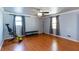 Bright living room with hardwood floors, two windows and a ceiling fan at 1497 Mason Mill Ne Rd, Atlanta, GA 30329
