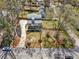 Aesthetic aerial view of home with beautiful trees, landscaping, and long driveway at 3087 Alston Dr, Decatur, GA 30032