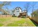 Spacious backyard featuring a modern home with a covered porch and a well-maintained wooden fence at 3087 Alston Dr, Decatur, GA 30032
