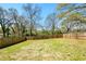 Large backyard featuring a grassy lawn, enclosed by a wooden fence, ideal for outdoor living at 3087 Alston Dr, Decatur, GA 30032