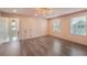 Bright bonus room with hardwood floors, modern lighting, and plentiful natural light at 3087 Alston Dr, Decatur, GA 30032