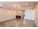 Light-filled bonus room features a wet bar with beverage fridge and modern light fixture at 3087 Alston Dr, Decatur, GA 30032