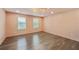 Spacious bonus room with hardwood floors, natural light, and modern lighting fixture at 3087 Alston Dr, Decatur, GA 30032