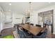 Bright dining room featuring a chandelier, wood floors, and view to kitchen and living room at 3087 Alston Dr, Decatur, GA 30032