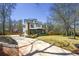View of modern two-story home featuring a long driveway and a manicured front lawn at 3087 Alston Dr, Decatur, GA 30032