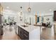 Kitchen featuring an island with seating, modern stainless appliances, and open concept living at 3087 Alston Dr, Decatur, GA 30032