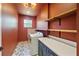 Well-appointed laundry room featuring ample cabinet space and modern appliances at 3087 Alston Dr, Decatur, GA 30032