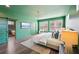 Large main bedroom with hardwood floors, modern lighting, and access to attached bath at 3087 Alston Dr, Decatur, GA 30032
