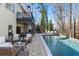 Backyard featuring a large in-ground pool, lounge seating, and a multi-story home at 230 Hardscrabble Rd, Roswell, GA 30075