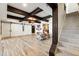 Basement with wooden ceiling beams, and an open floorplan with luxury vinyl plank flooring at 230 Hardscrabble Rd, Roswell, GA 30075