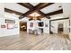Open basement area with wood beams, stylish furniture, and luxury vinyl plank flooring throughout at 230 Hardscrabble Rd, Roswell, GA 30075