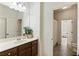 Bright bathroom offering a view of another room, a vanity, and ample space at 230 Hardscrabble Rd, Roswell, GA 30075