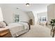 Bedroom featuring a simple bed, neutral carpet, and natural light from the window at 230 Hardscrabble Rd, Roswell, GA 30075