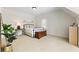 Cozy bedroom with a sloped ceiling, carpet, a bed, and a window for natural light at 230 Hardscrabble Rd, Roswell, GA 30075