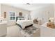 Bright bedroom with a comfortable bed, a desk, and natural light, perfect for relaxation and productivity at 230 Hardscrabble Rd, Roswell, GA 30075