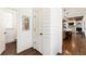 Hallway with shiplap walls that provide access to the kitchen and a half bathroom at 230 Hardscrabble Rd, Roswell, GA 30075