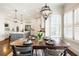 Open concept kitchen and dining area featuring hardwood floors and lots of natural light at 230 Hardscrabble Rd, Roswell, GA 30075