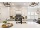 Bright, open kitchen featuring a large island, quartz countertops, and stylish lighting at 230 Hardscrabble Rd, Roswell, GA 30075