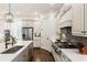 Modern kitchen with stainless steel appliances, an island and white cabinets at 230 Hardscrabble Rd, Roswell, GA 30075