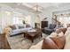 Spacious living room with coffered ceilings, hardwood floors, and sophisticated decor and furnishings at 230 Hardscrabble Rd, Roswell, GA 30075