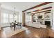 Open concept living room featuring hardwood floors and large windows at 230 Hardscrabble Rd, Roswell, GA 30075