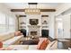 Warm living room with a stone fireplace and stylish decor at 230 Hardscrabble Rd, Roswell, GA 30075