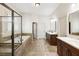 Elegant main bathroom with a soaking tub, glass shower enclosure, and double vanity at 230 Hardscrabble Rd, Roswell, GA 30075