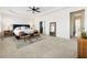 Bright main bedroom with carpet, large windows, and shiplap accent wall, creating a serene retreat at 230 Hardscrabble Rd, Roswell, GA 30075