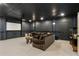 Cozy home theater boasts a large screen, projector, comfortable seating, and a popcorn machine at 230 Hardscrabble Rd, Roswell, GA 30075