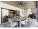 Covered patio featuring a ceiling fan, a dining table with seating, and an outdoor grill at 230 Hardscrabble Rd, Roswell, GA 30075