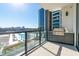 Balcony with an outdoor kitchen and a view of the pool and city at 2425 Peachtree Ne Rd # 505, Atlanta, GA 30305