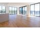 Bright living area with floor-to-ceiling windows, hardwood floors, and an open floor plan at 2425 Peachtree Ne Rd # 505, Atlanta, GA 30305