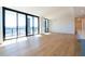 Open and airy living area with hardwood floors, expansive windows, and an open layout at 2425 Peachtree Ne Rd # 505, Atlanta, GA 30305