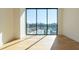 Bright living room features expansive windows with city views and access to pool area at 2425 Peachtree Ne Rd # 505, Atlanta, GA 30305