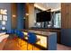Stylish lounge area with a built-in bar area, comfortable seating, and warm lighting for relaxation and socializing at 2425 Peachtree Ne Rd # 505, Atlanta, GA 30305